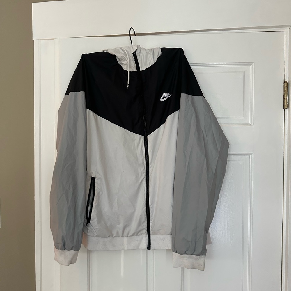Nike men’s zip up hooded windbreaker 
Size XL
Grey, black and white
